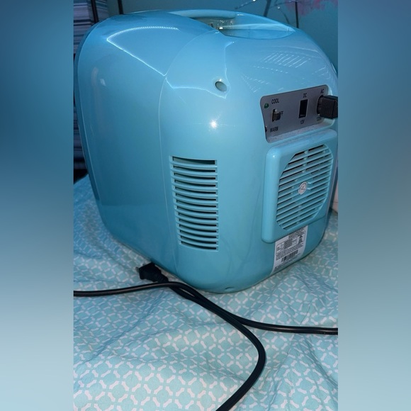 A teal mini fridge that will keep your drinks cold for a while! - Picture 1 of 4